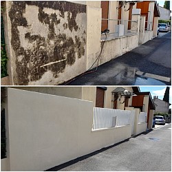 Nettoyage d'un mur de clôture